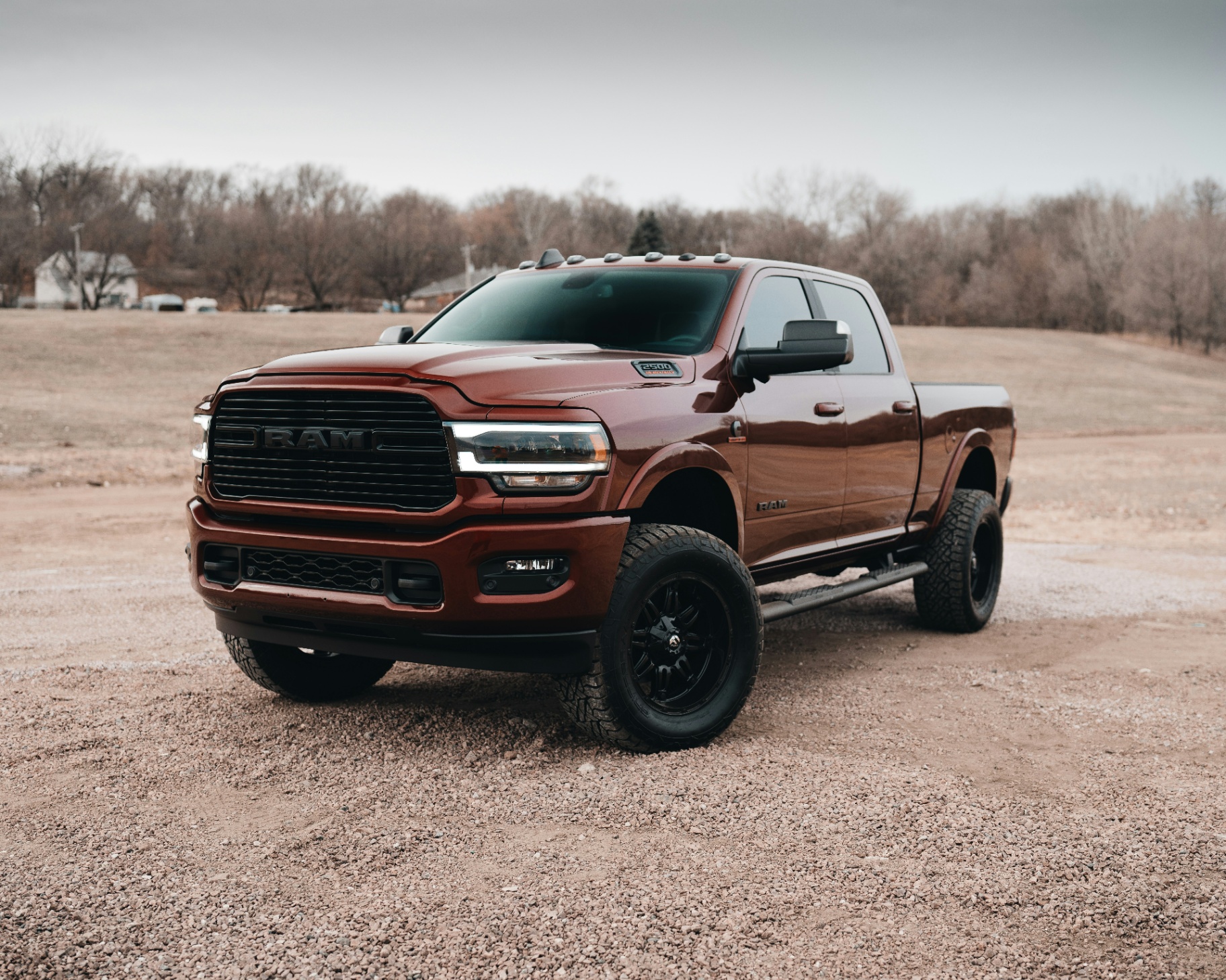 Clean red RAM 2500 truck in a rural setting