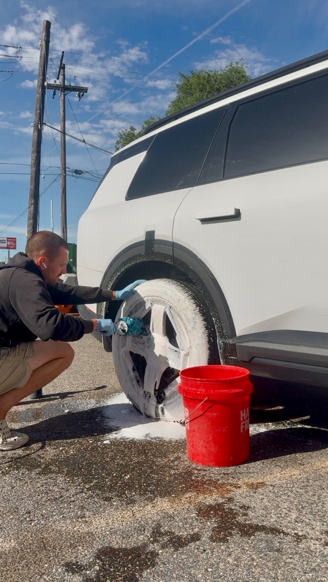 PRO DTLR detailer hand washing a vehicle during a Refresh Detail service