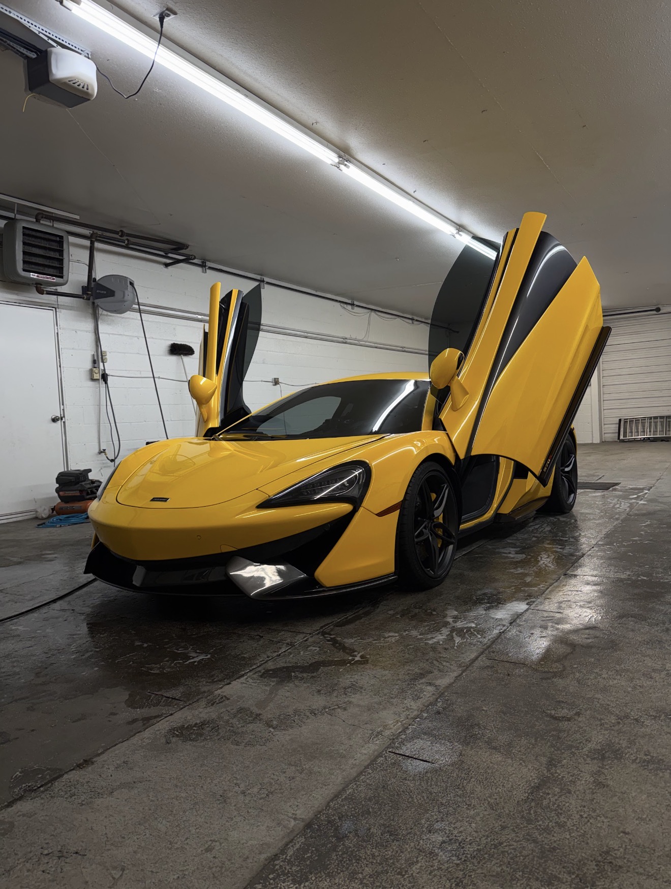 Yellow McLaren with doors up